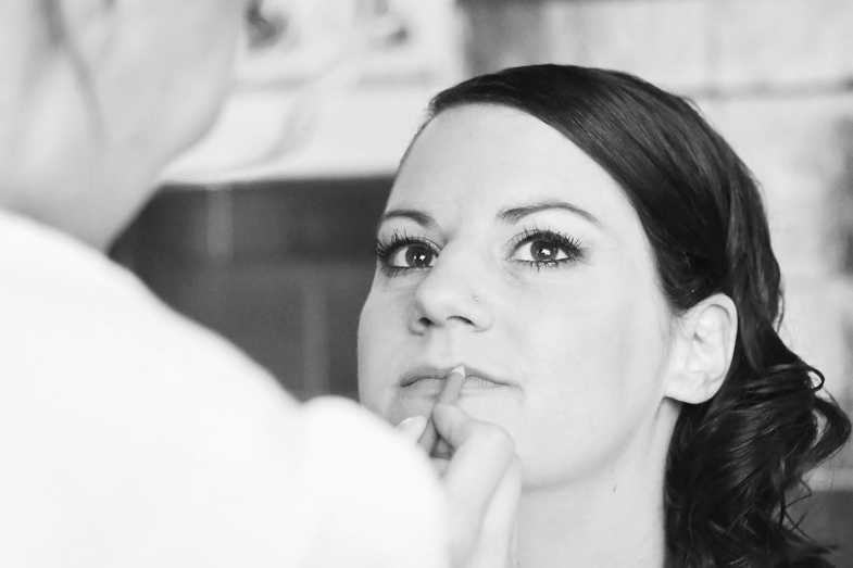 Makeup artist during wedding makeup.